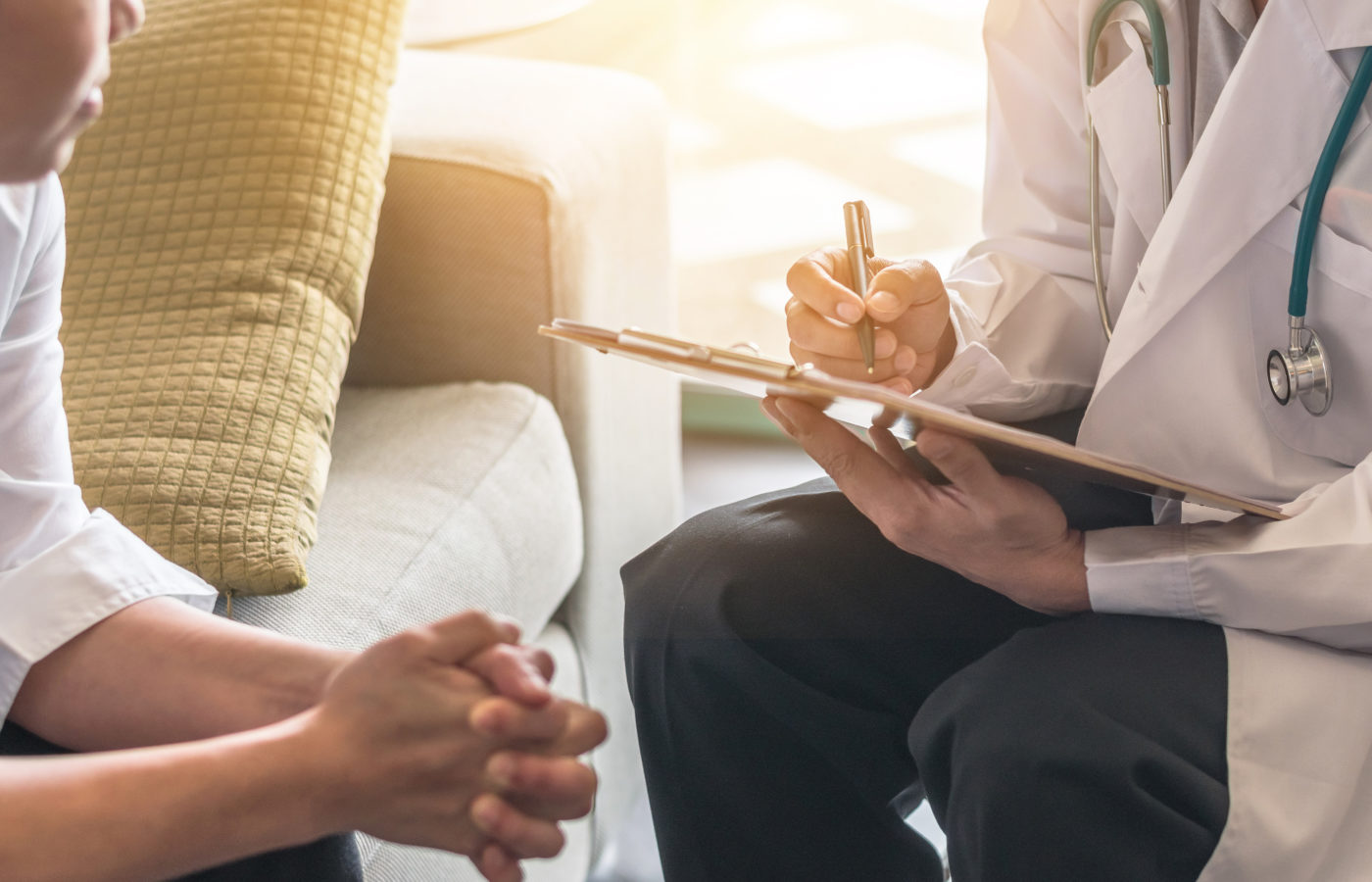 Woman patient having consultation with doctor (gynecologist or psychiatrist) and examining  health in medical gynecological clinic or hospital mental health service center